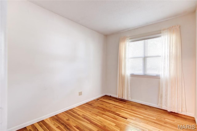 4828 Plum Tree Ln, Hazelwood, MO 63042 - spare room with baseboards and light wood-style flooring