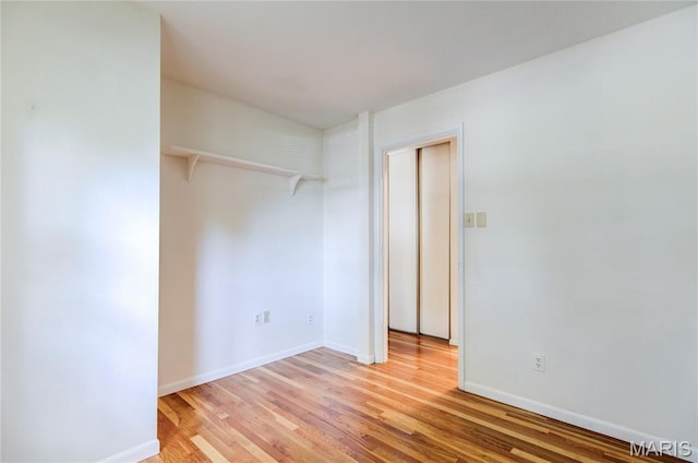 4828 Plum Tree Ln, Hazelwood, MO 63042 - unfurnished bedroom with light wood-style floors and baseboards