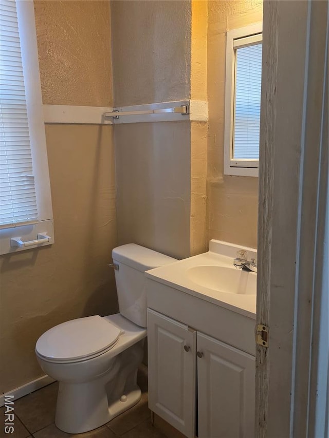 3421 Belt Ave, Saint Louis, MO 63120 - bathroom with vanity, tile patterned floors, and a textured wall