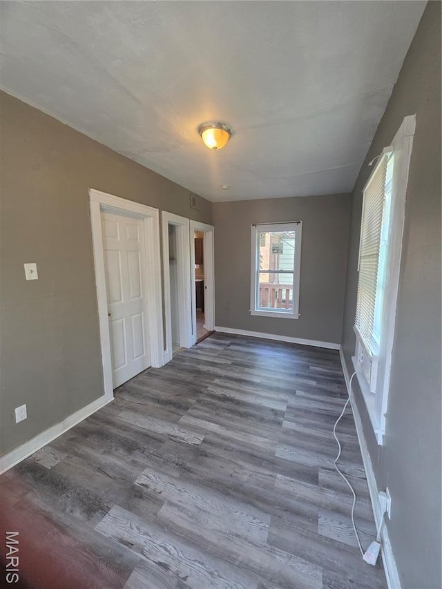 3421 Belt Ave, Saint Louis, MO 63120 - unfurnished bedroom with wood finished floors and baseboards