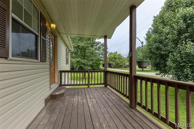 136 County Road 4415, Poplar Bluff, MO 63901 - wooden deck featuring a lawn