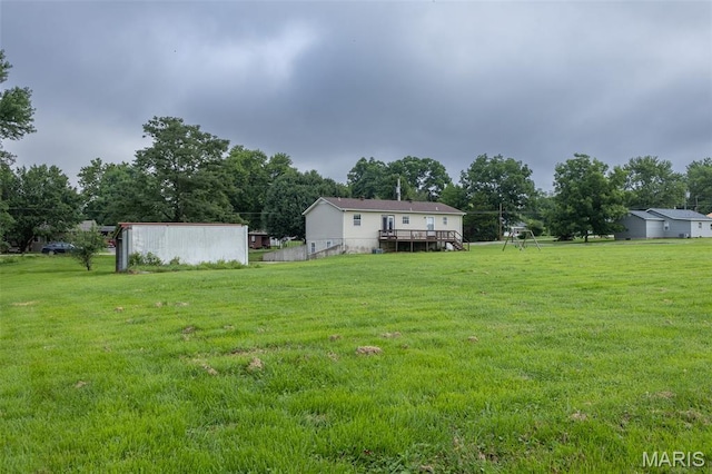 136 County Road 4415, Poplar Bluff, MO 63901 - view of grassy yard with a wooden deck