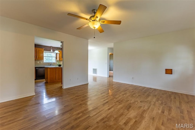136 County Road 4415, Poplar Bluff, MO 63901 - unfurnished living room with wood finished floors and ceiling fan