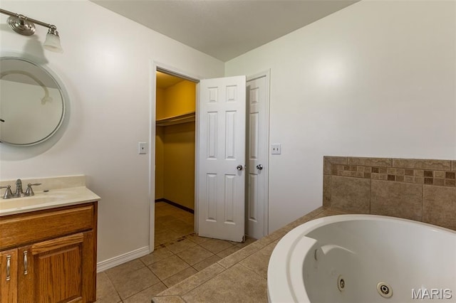 136 County Road 4415, Poplar Bluff, MO 63901 - bathroom with vanity, a whirlpool tub, and tile patterned flooring