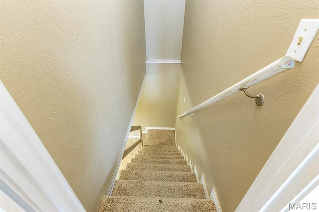 136 County Road 4415, Poplar Bluff, MO 63901 - staircase featuring a textured wall and carpet floors