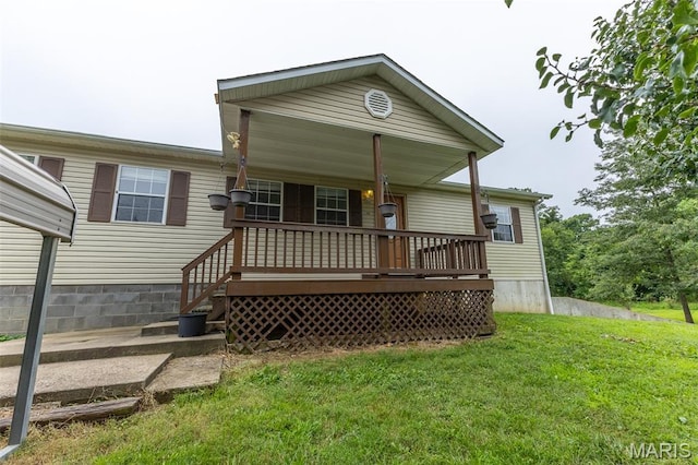 136 County Road 4415, Poplar Bluff, MO 63901 - back of property with a lawn and covered porch