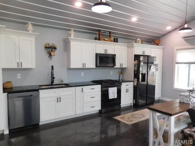 203 E 5th St, Kinmundy, IL 62854 - kitchen featuring black appliances, white cabinetry, dark countertops, hanging light fixtures, and recessed lighting