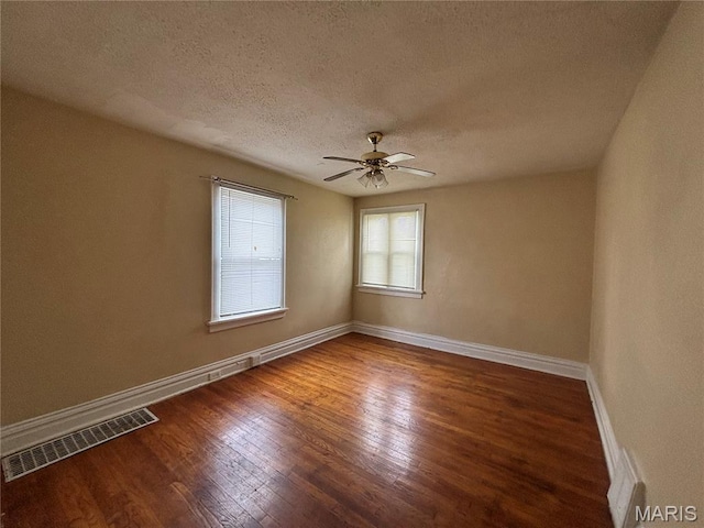 6104 N Pointe Blvd, Saint Louis, MO 63147 - empty room featuring a textured ceiling, wood finished floors, and ceiling fan