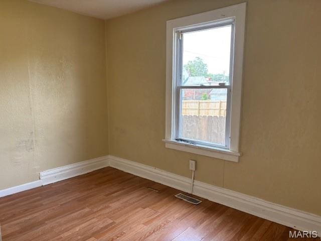6104 N Pointe Blvd, Saint Louis, MO 63147 - spare room with light wood-style floors and baseboards