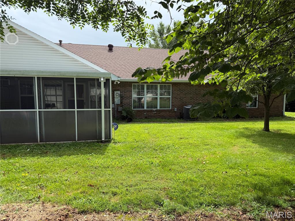 530 Ashbrook Unit 30, Farmington, MO 63640 - view of grassy yard featuring a sunroom