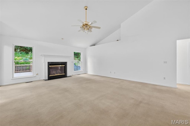 36 Mountain Laurel Dr, Saint Peters, MO 63376 - unfurnished living room with high vaulted ceiling, light colored carpet, plenty of natural light, and a ceiling fan