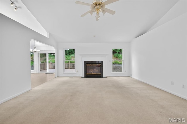36 Mountain Laurel Dr, Saint Peters, MO 63376 - unfurnished living room featuring carpet, a fireplace with flush hearth, a ceiling fan, a chandelier, and high vaulted ceiling