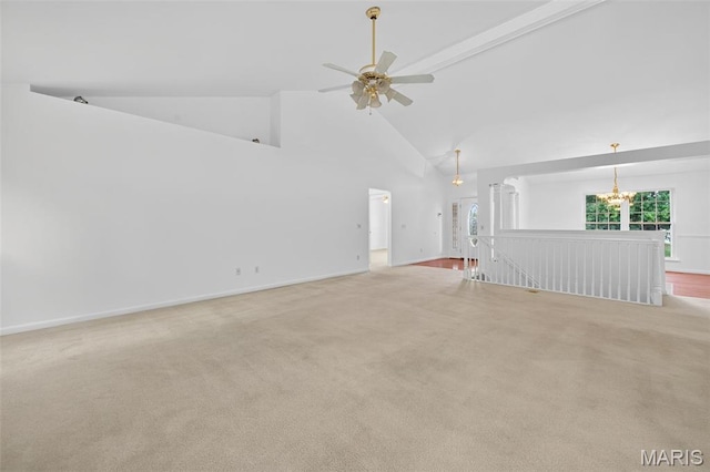 36 Mountain Laurel Dr, Saint Peters, MO 63376 - unfurnished living room featuring high vaulted ceiling, a ceiling fan, a chandelier, and light colored carpet