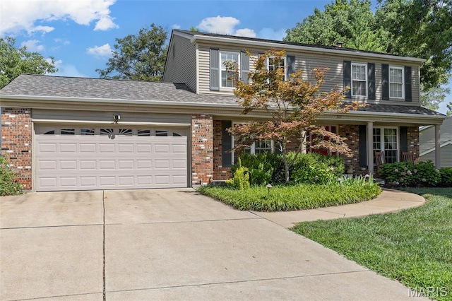307 Blue Ridge Place Ct, Ballwin, MO 63011 - traditional-style house with brick siding, concrete driveway, and a garage