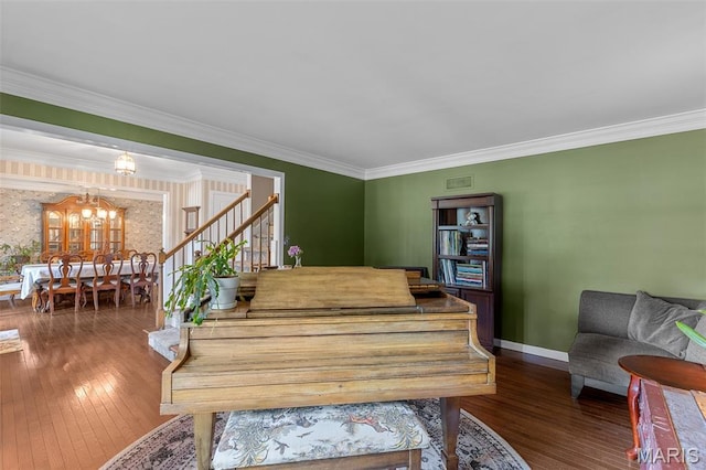307 Blue Ridge Place Ct, Ballwin, MO 63011 - dining room featuring wood-type flooring, a chandelier, stairway, ornamental molding, and wallpapered walls