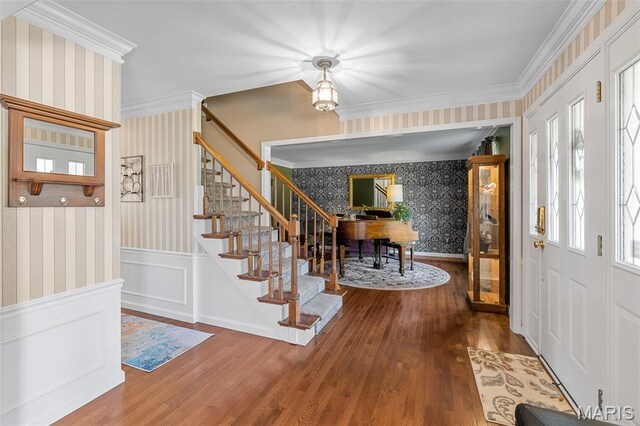 307 Blue Ridge Place Ct, Ballwin, MO 63011 - entrance foyer featuring wallpapered walls, hardwood / wood-style flooring, stairway, ornamental molding, and a wainscoted wall