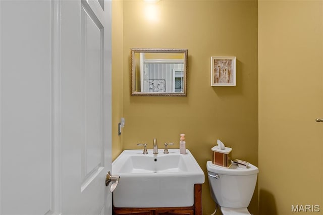 307 Blue Ridge Place Ct, Ballwin, MO 63011 - half bathroom featuring toilet and a sink