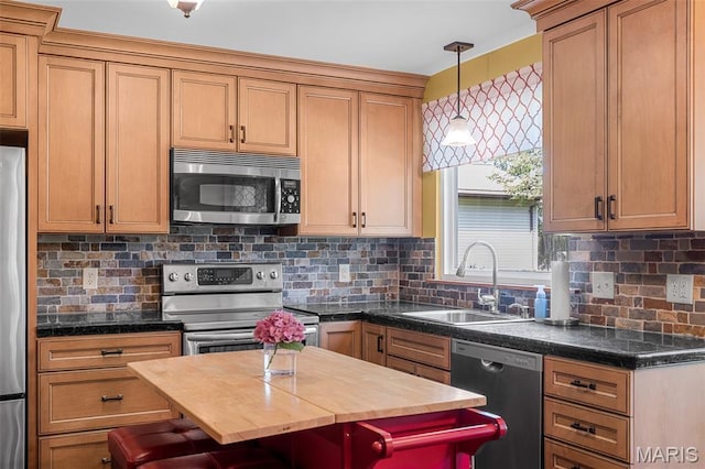 307 Blue Ridge Place Ct, Ballwin, MO 63011 - kitchen with stainless steel appliances, a kitchen breakfast bar, pendant lighting, and tasteful backsplash