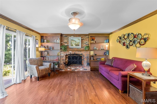 307 Blue Ridge Place Ct, Ballwin, MO 63011 - living room with wood finished floors, ornamental molding, built in features, and a fireplace