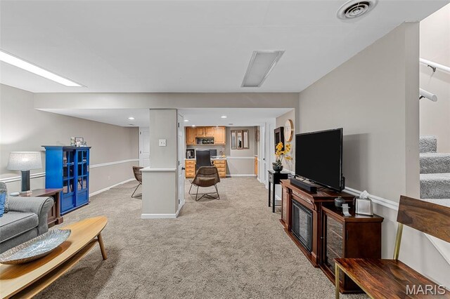 307 Blue Ridge Place Ct, Ballwin, MO 63011 - living area with light colored carpet, stairway, and recessed lighting