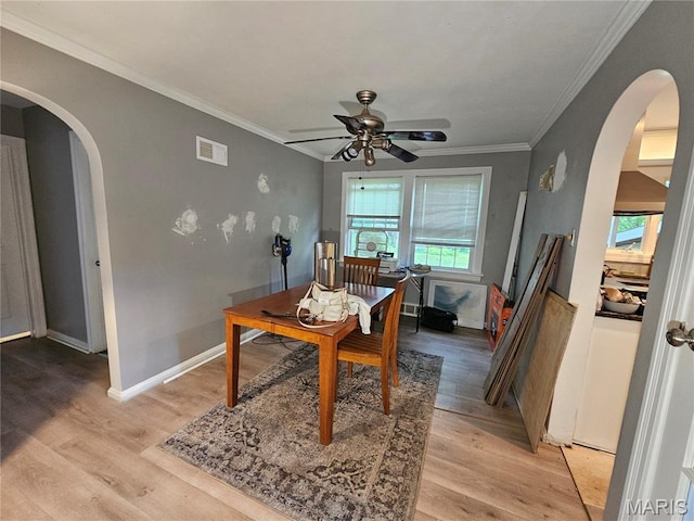 2060 Washington St, Florissant, MO 63033 - office with arched walkways, ceiling fan, light wood finished floors, and ornamental molding