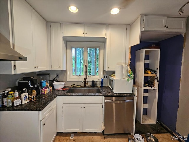 2060 Washington St, Florissant, MO 63033 - kitchen featuring stainless steel dishwasher, white cabinetry, wall chimney exhaust hood, recessed lighting, and white microwave