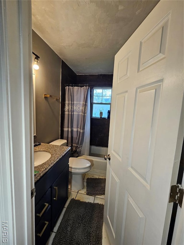 2060 Washington St, Florissant, MO 63033 - full bath with vanity, tile patterned floors, and shower / tub combo
