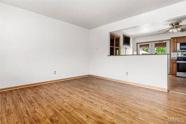 5311 Grove Ave, Ferguson, MO 63135 - empty room featuring light wood finished floors and ceiling fan