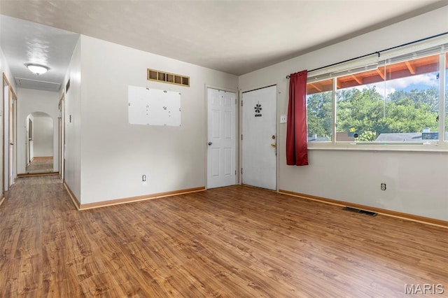 5311 Grove Ave, Ferguson, MO 63135 - foyer featuring wood finished floors and arched walkways