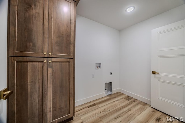 1817 Vadie Ave, Lebanon, MO 65536 - washroom with cabinet space, hookup for an electric dryer, light wood-style floors, washer hookup, and recessed lighting