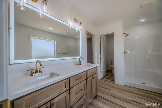 1817 Vadie Ave, Lebanon, MO 65536 - full bath featuring double vanity, wood finished floors, a shower, and recessed lighting