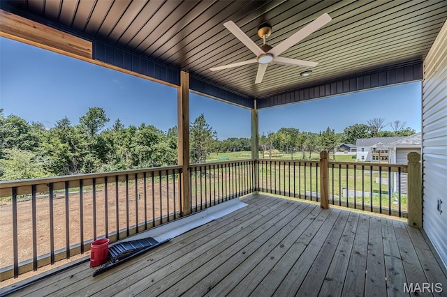 1817 Vadie Ave, Lebanon, MO 65536 - deck featuring a ceiling fan and view of scattered trees