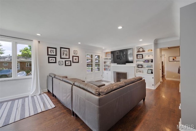 7700 Weil Ave, Saint Louis, MO 63119 - living area with a fireplace, recessed lighting, dark wood-style floors, and built in features