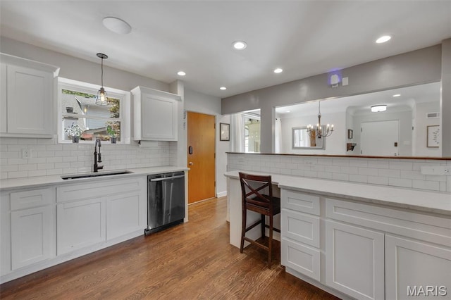 7700 Weil Ave, Saint Louis, MO 63119 - kitchen featuring dishwasher, backsplash, white cabinets, light countertops, and recessed lighting