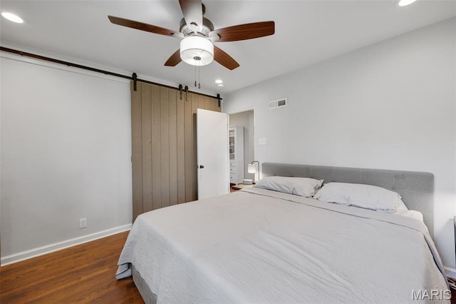 7700 Weil Ave, Saint Louis, MO 63119 - bedroom with a barn door, recessed lighting, wood finished floors, and ceiling fan