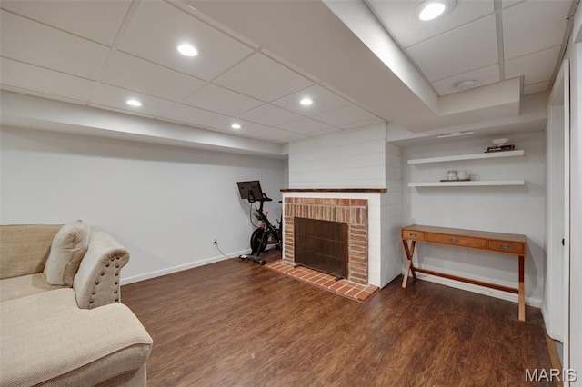 7700 Weil Ave, Saint Louis, MO 63119 - living room with wood finished floors, recessed lighting, a fireplace, and a drop ceiling