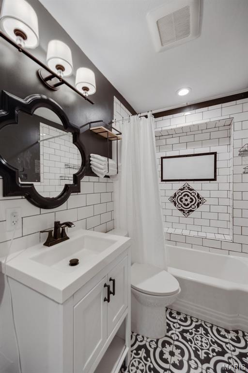 7700 Weil Ave, Saint Louis, MO 63119 - bathroom with vanity, tile patterned floors, shower / bath combination with curtain, tasteful backsplash, and recessed lighting
