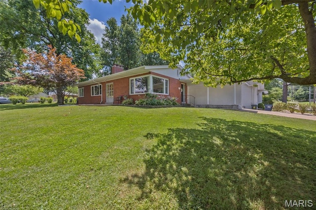 7700 Weil Ave, Saint Louis, MO 63119 - ranch-style house with a chimney, a front lawn, and brick siding