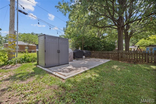 7700 Weil Ave, Saint Louis, MO 63119 - fenced backyard with a shed and a patio area