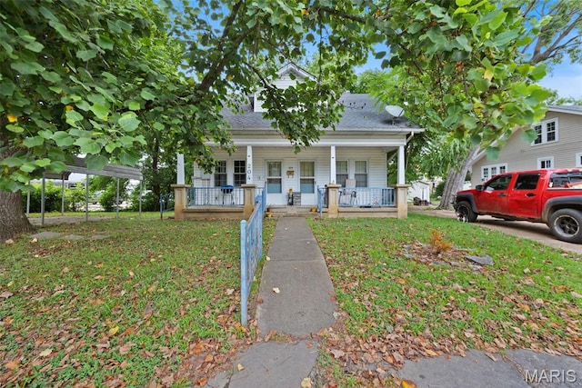 204 E Jefferson St, Potosi, MO 63664 - bungalow-style home featuring covered porch, a front lawn, and roof with shingles