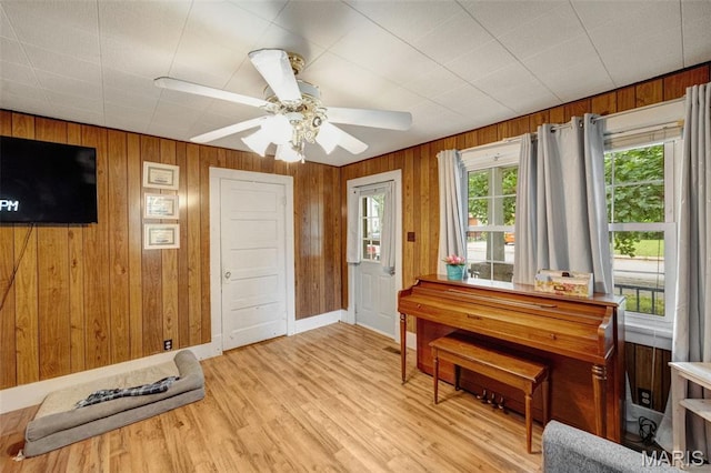 204 E Jefferson St, Potosi, MO 63664 - entryway featuring light wood-type flooring, ceiling fan, and wood walls