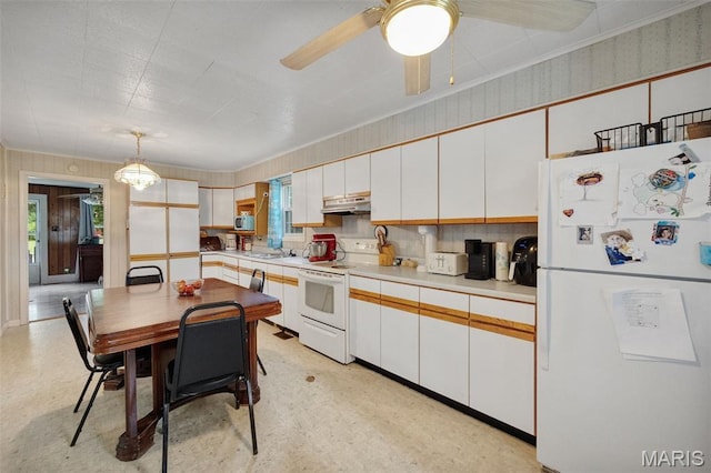 204 E Jefferson St, Potosi, MO 63664 - kitchen with white appliances, under cabinet range hood, white cabinetry, and plenty of natural light