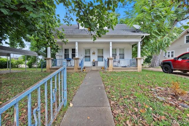204 E Jefferson St, Potosi, MO 63664 - view of front of house with a porch, a front lawn, and roof with shingles