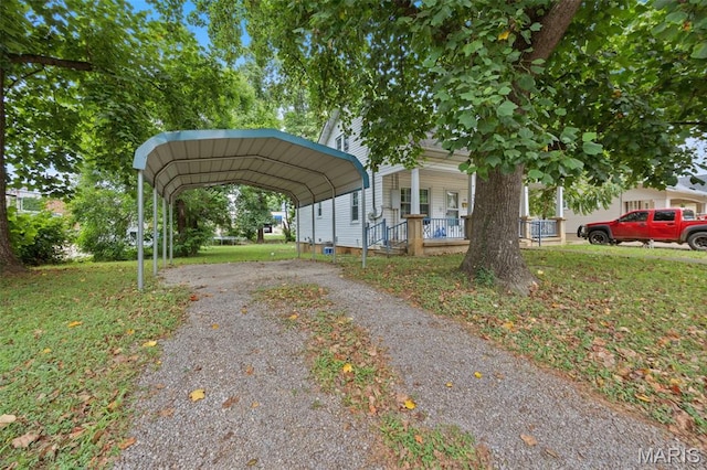 204 E Jefferson St, Potosi, MO 63664 - view of car parking with asphalt driveway and a detached carport