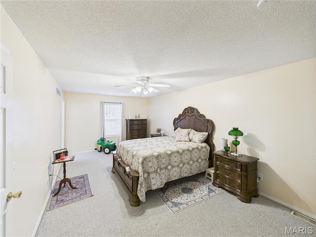 1110 State Highway Ad, Dexter, MO 63841 - carpeted bedroom with a textured ceiling and ceiling fan