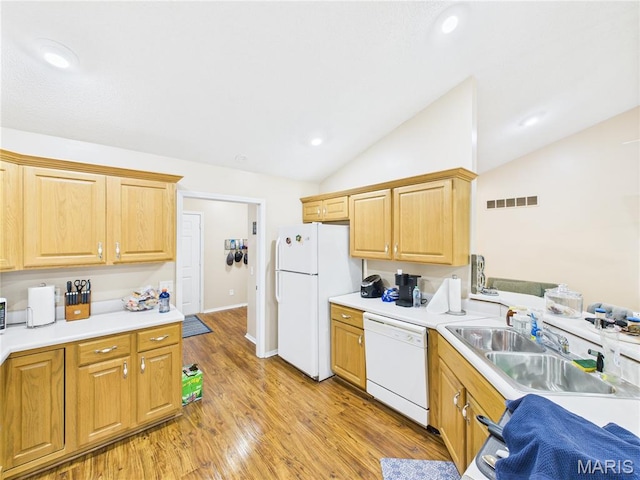 1110 State Highway Ad, Dexter, MO 63841 - kitchen featuring white appliances, lofted ceiling, light countertops, light wood-type flooring, and recessed lighting