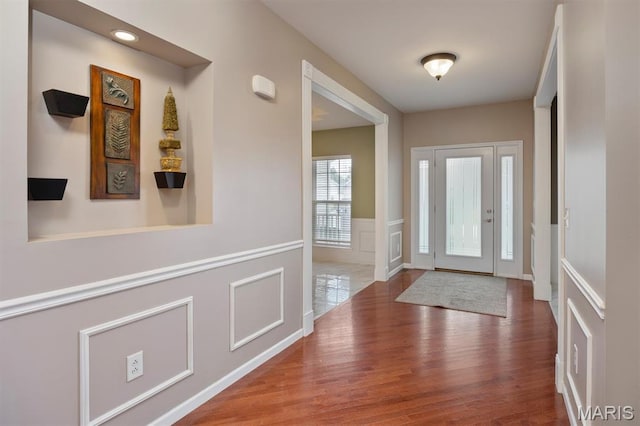 1305 Monarch Lake Ln, Shiloh, IL 62221 - foyer with wood finished floors, a decorative wall, and a wainscoted wall