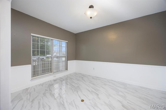 1305 Monarch Lake Ln, Shiloh, IL 62221 - unfurnished room with marble look tile flooring and wainscoting