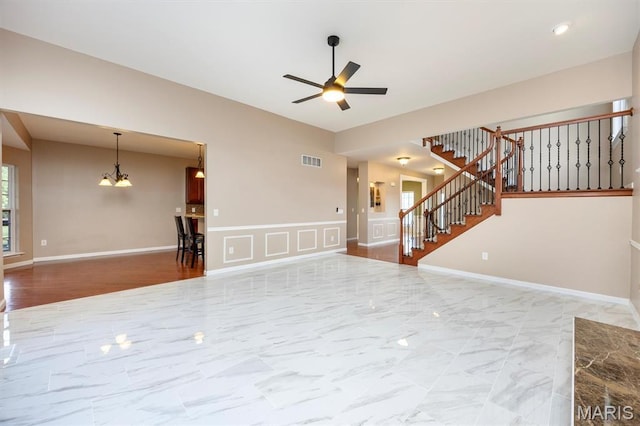 1305 Monarch Lake Ln, Shiloh, IL 62221 - unfurnished living room with a ceiling fan, stairway, a chandelier, and marble finish floors