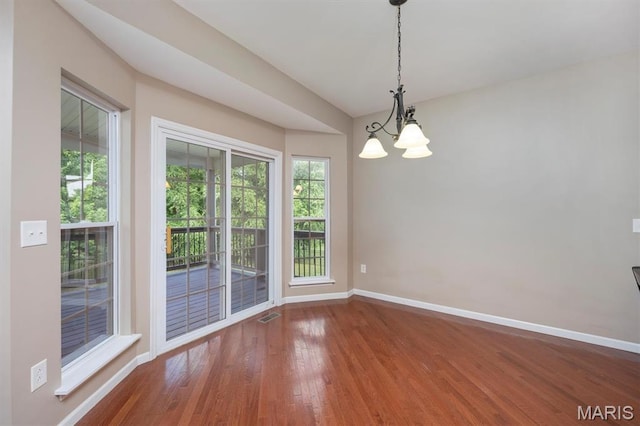 1305 Monarch Lake Ln, Shiloh, IL 62221 - unfurnished room featuring wood finished floors, healthy amount of natural light, and a chandelier